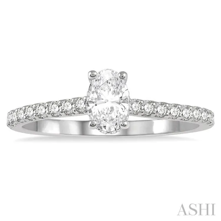 1/2 ctw Round Cut Diamond Engagement Ring With 1/4 ctw Oval Cut Center Stone in 14K White Gold