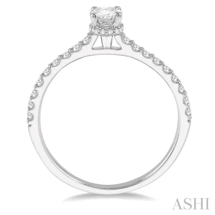 1/2 ctw Round Cut Diamond Engagement Ring With 1/4 ctw Oval Cut Center Stone in 14K White Gold