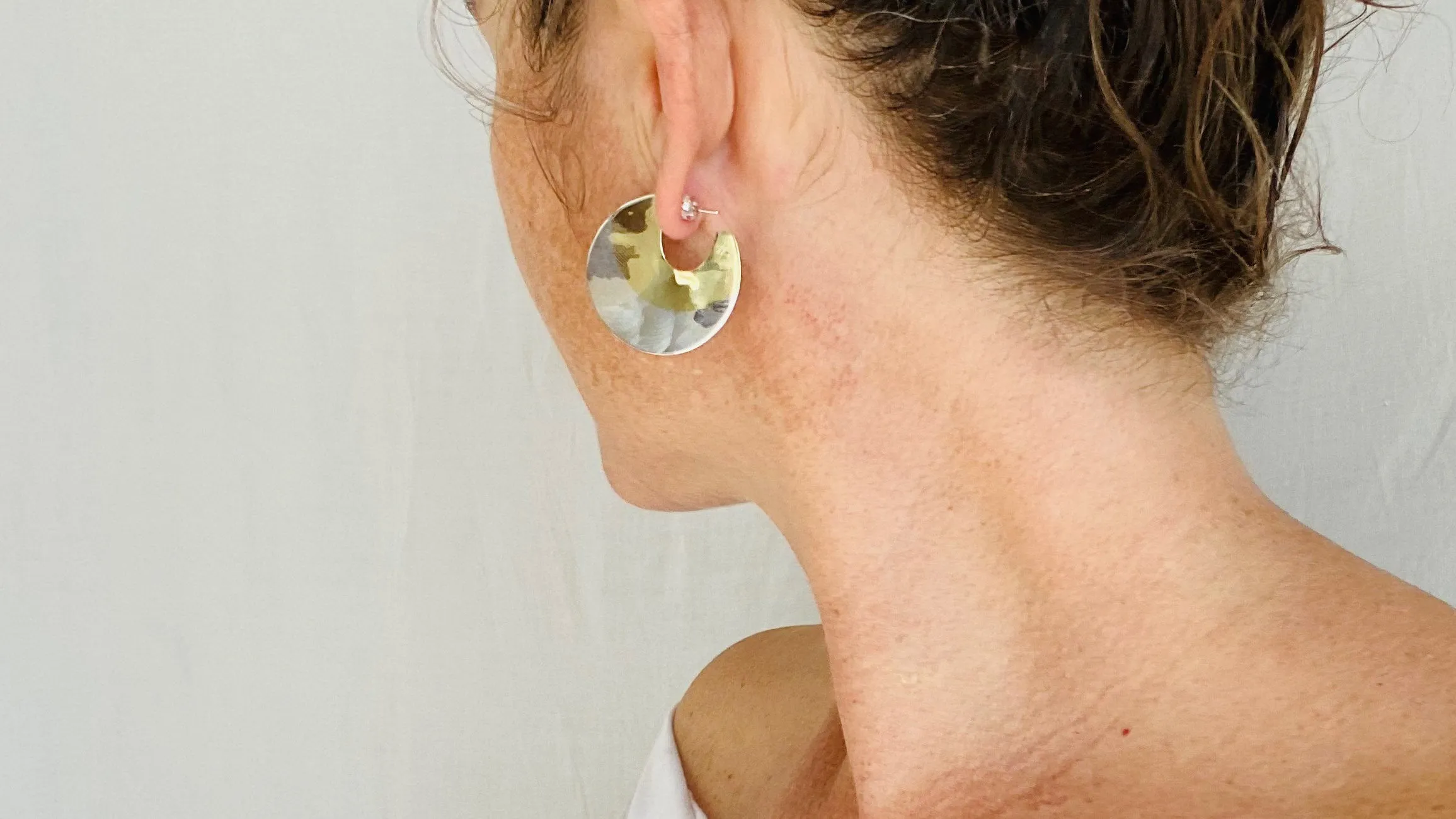 Sterling Silver and Brass Flat Hoop Earrings.